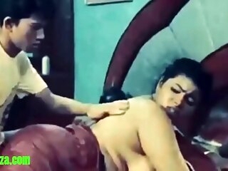 Indian daughter massages mom